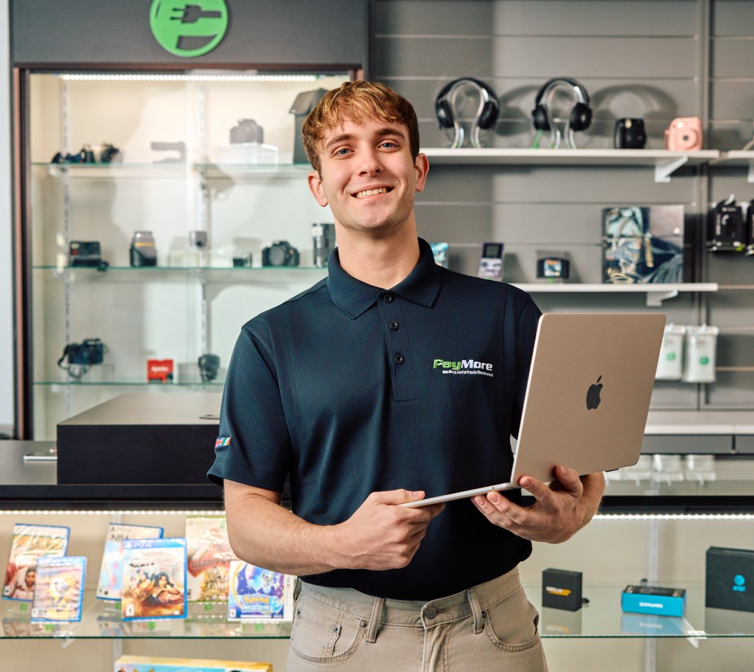 PayMore employee with laptop